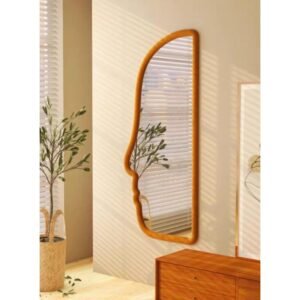 Velvet face shaped full-length mirror in brown, green, black, and white with wall mount display.