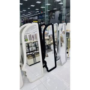 Velvet face shaped full-length mirror in brown, green, black, and white with wall mount display.